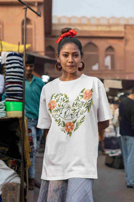 Girl-wearing-ladies-oversized-t-shirt-featuring-graphic-design-perfect-for-casual-fashion-and-trendy-streetwear. white